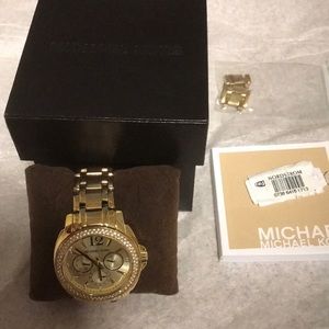 Gold Michael Kors watch.